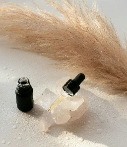 a bottle of cologne next to a bottle of cologne